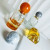 Low Moq Clear Square Round Shape Spray Glass Perfume Bottle 50ml Volcano Base Perfume Glass Bottles with Resin Ball Cap